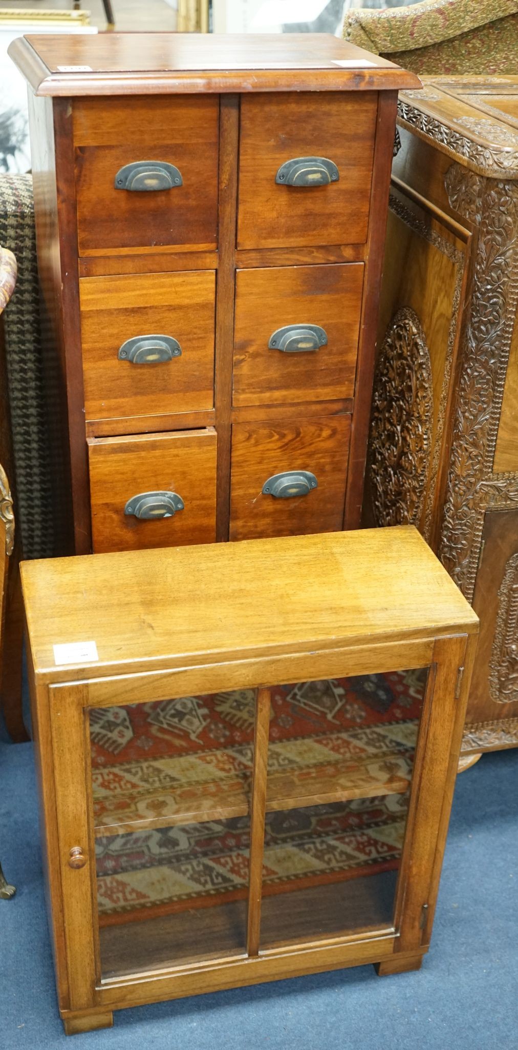 A reproduction hardwood ten drawer narrow chest, width 40cm, depth 26cm, height 102cm together with a glazed hardwood wall cabinet